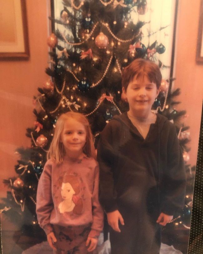 Ira David Wood III and Evan Rachel Wood posing with the Christmas tree